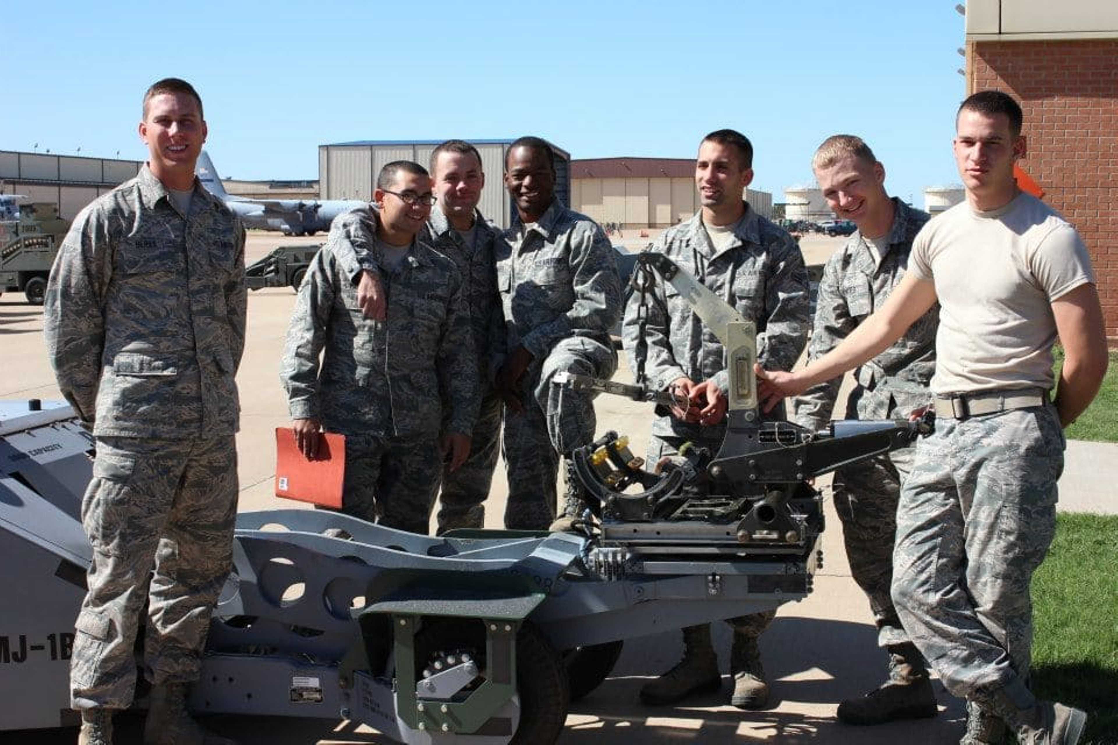 Clayton Breland in the Air Force with a bomb forklift called a jammer